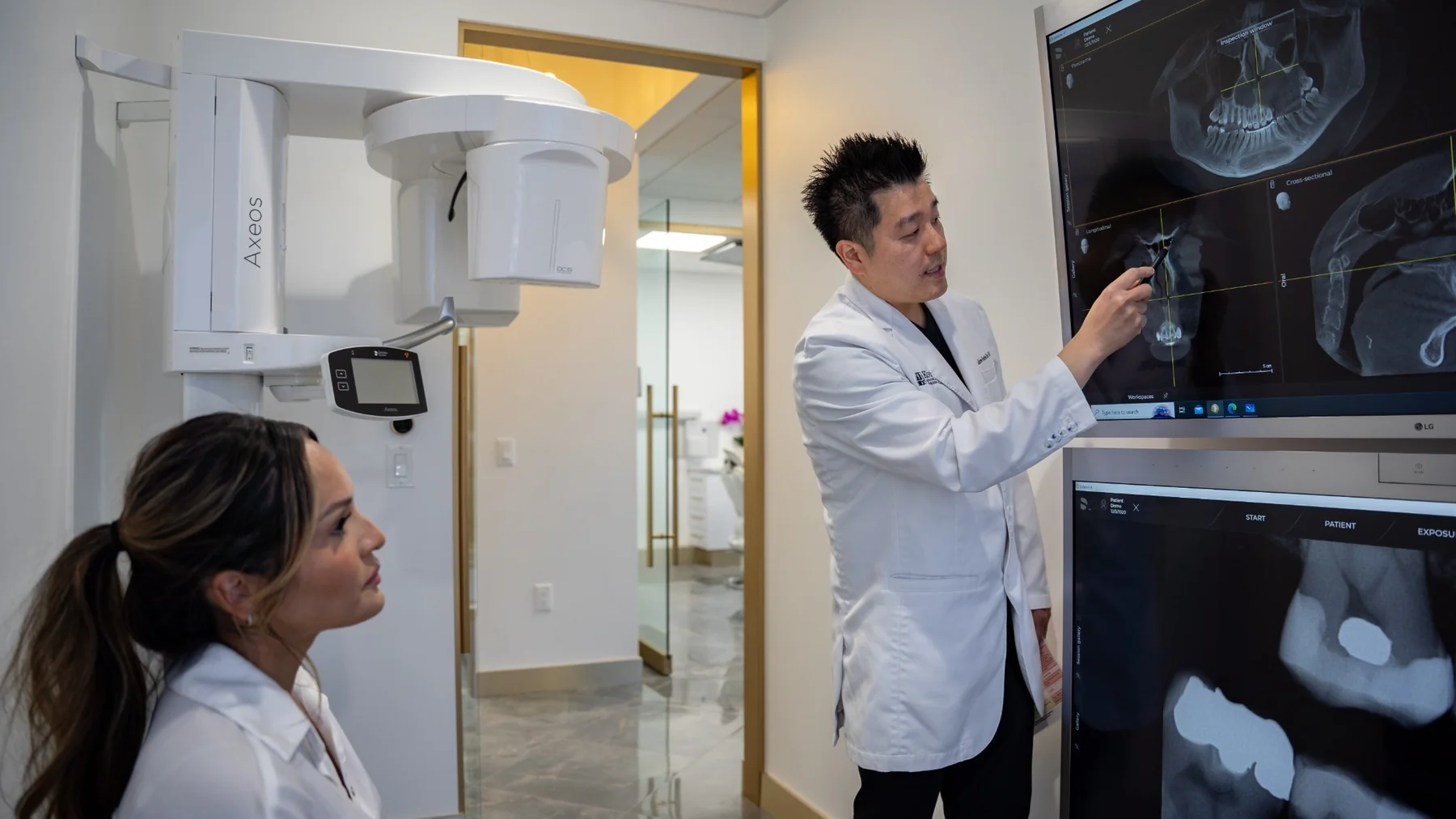 Dr. Andrew-Sunjun Kim reviewing 3D dental imaging